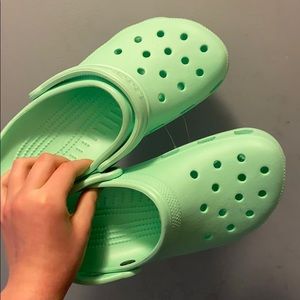 Mint Green Crocs shoes.